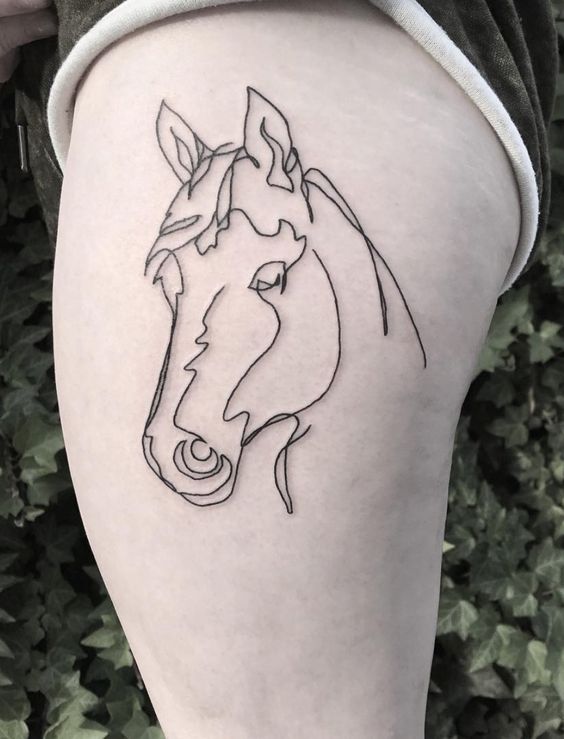 Simple horse face tattoo look stunning on thigh.