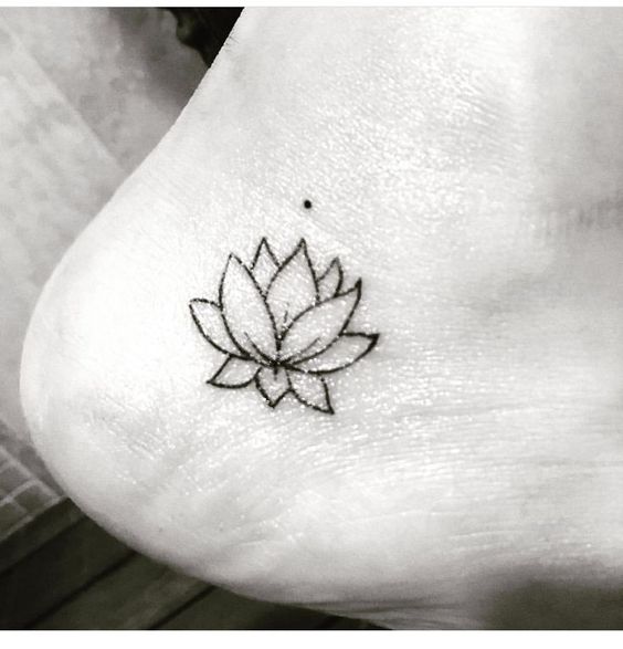 Simple lotus tattoo on ankle.
