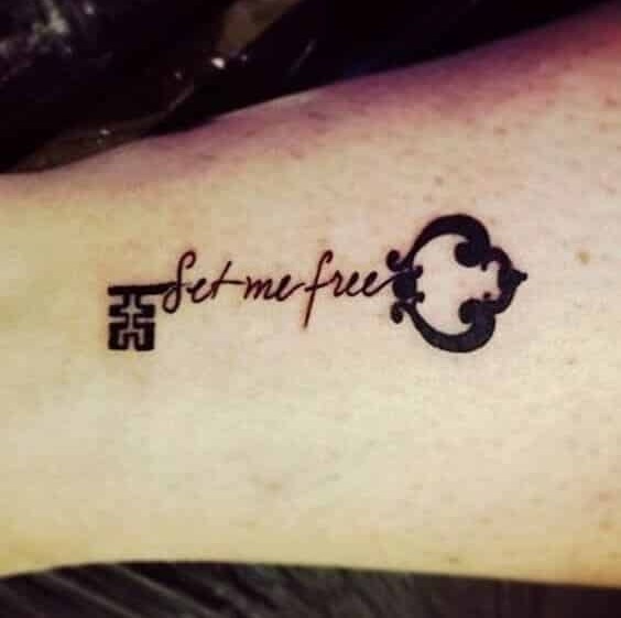 Small key tattoo with meaningful message.