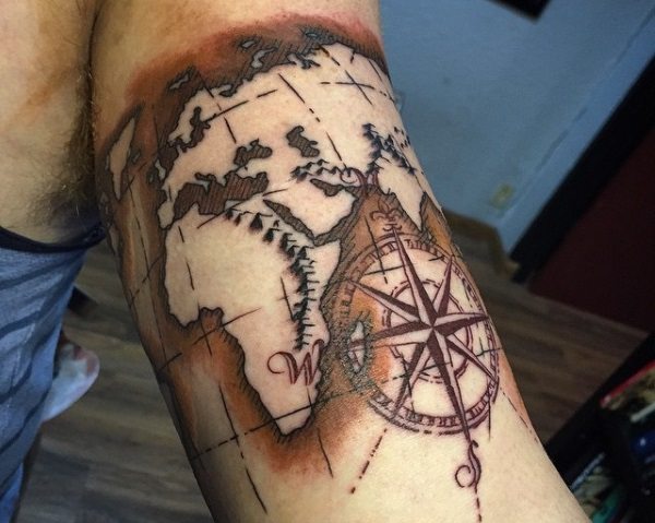 Spectacular world map tattoo on bicep.