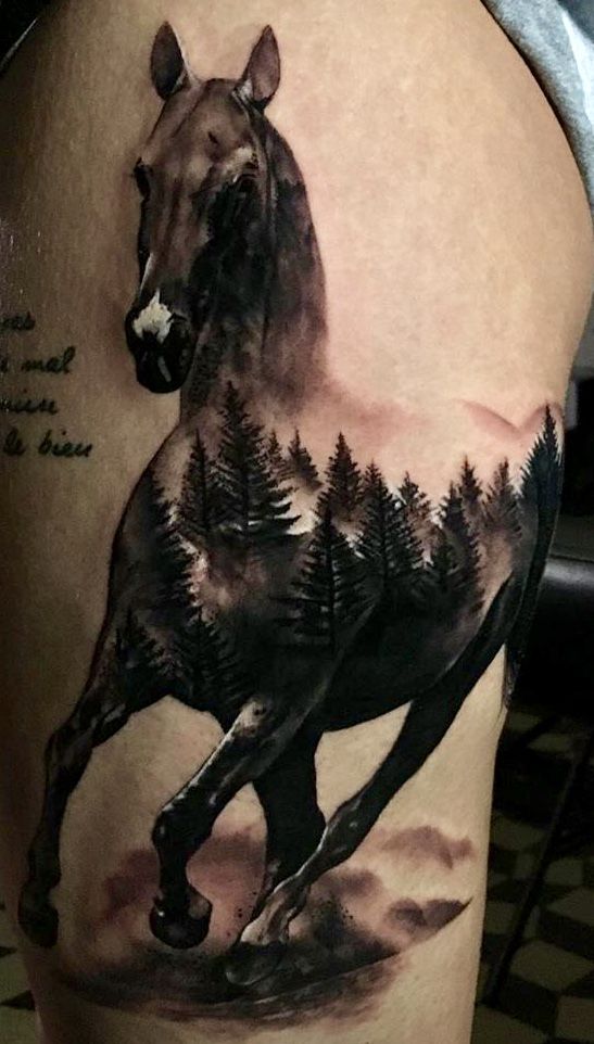 Stunning horse forest tattoo.
