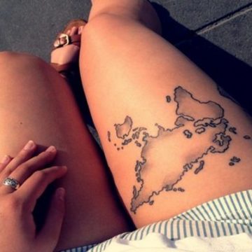 Sultry map tattoo on thigh.