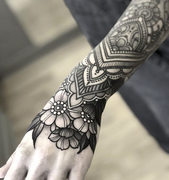 This lace tattoo design is unique and nicely fits with flowers on arm.