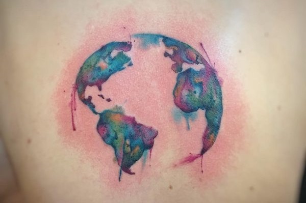 This round world tattoo is beautiful, with bright colors and an artistic dripping effect.