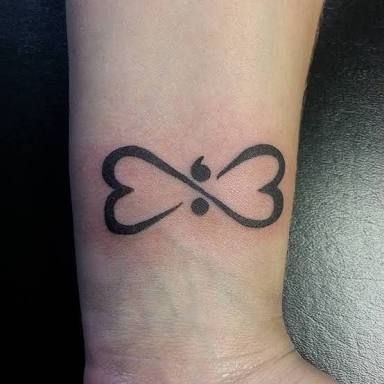 Two hearts make an infinity sign with semicolon.