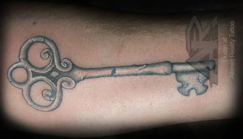 Uncommon key tattoo design.