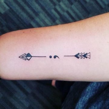 Unique arrow semicolon tattoo idea.