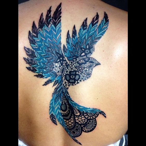 Unique black lace paisley blue bird tattoo on back.