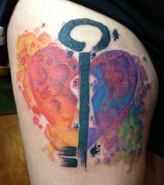 Water color colorful heart with black key tattoo design for thigh.