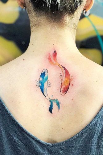 Watercolor yin yang fish on back.