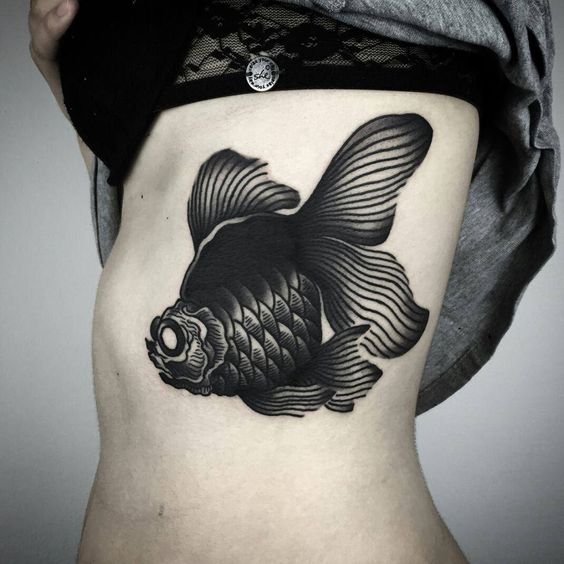 Wonderful big black fish tattoo.