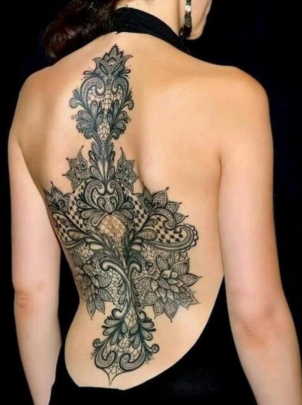 Wonderful lace tattoo on back. 