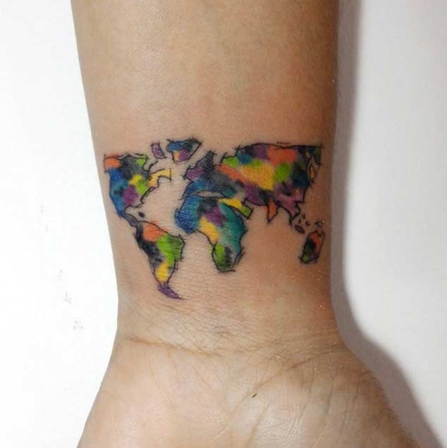 World map wrist tattoo with sketchy outlines.