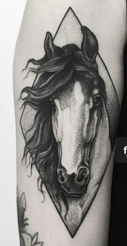 You can try a dot work horse tattoo design which will look really
