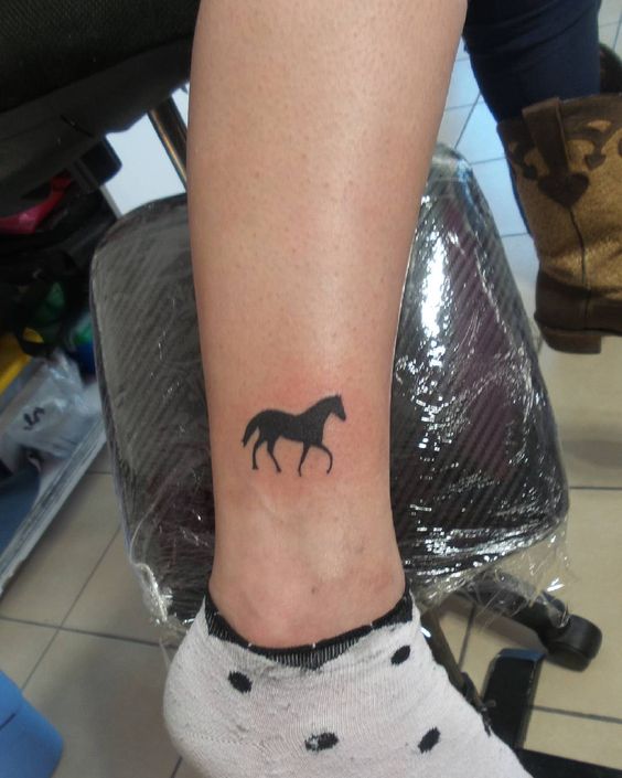 You can try simple black horse tattoo for ankle.