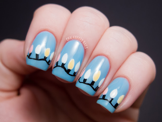 Charming Christmas light nails.