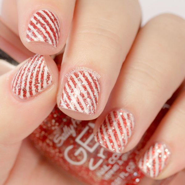 Chic glittery candy cane nails.