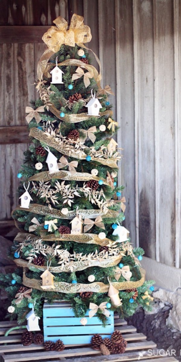 Christstmas tree with mini birdhouse ornaments.