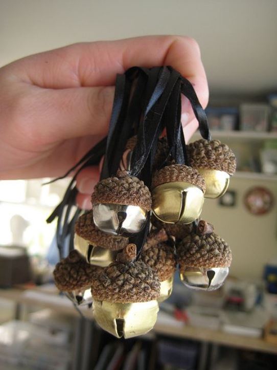 Covered jingle bell with acorn caps.