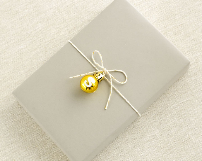 Creative bell ornament on gift wrap.