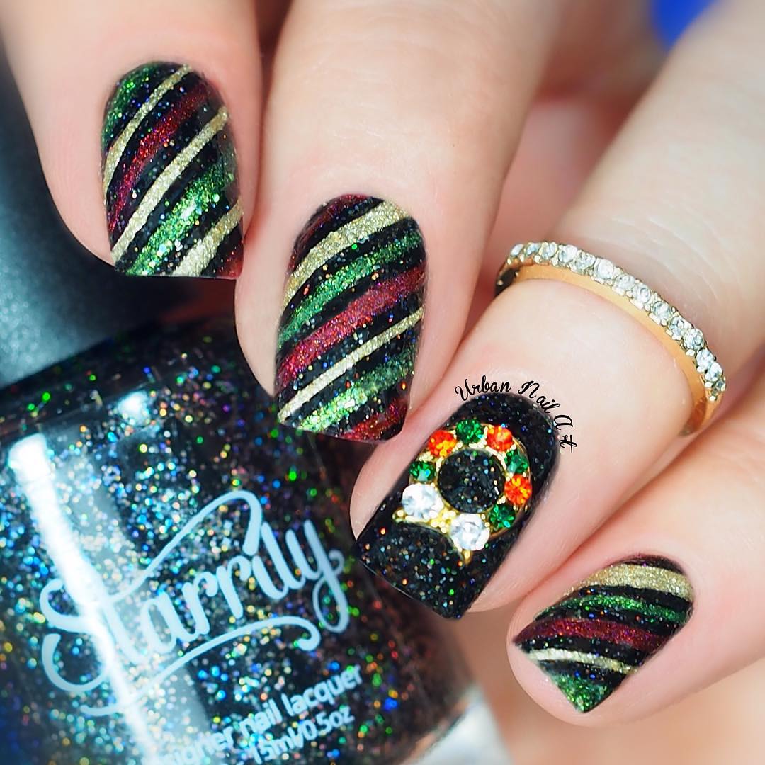 Fabulous glittery diagonal stripe nails.