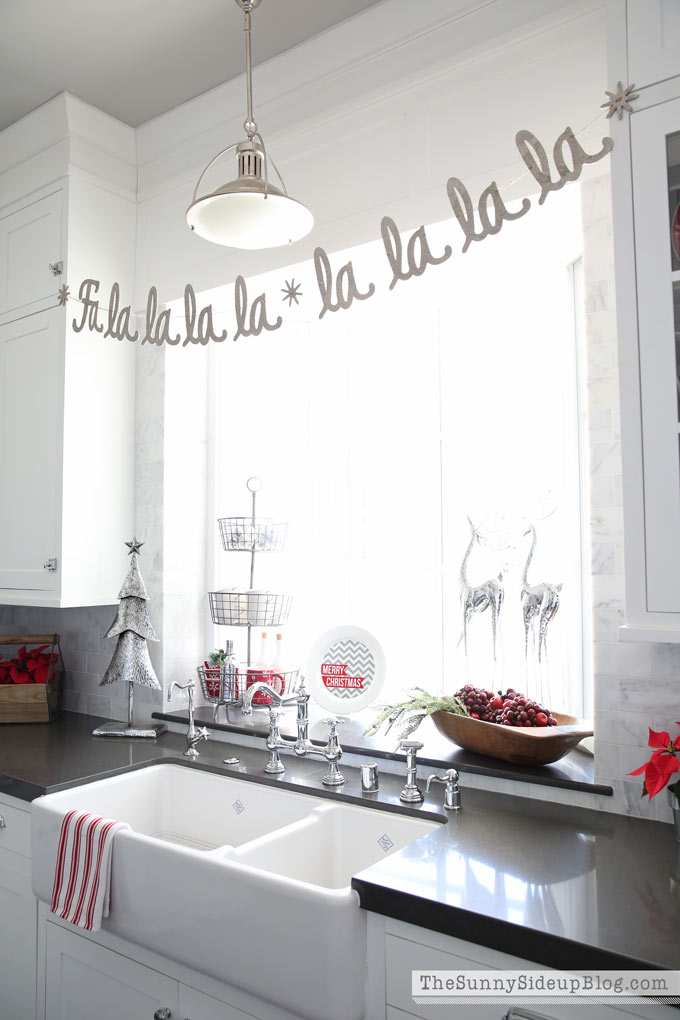 Fantastic kitchen decor with metal tree, reindeer and garland.