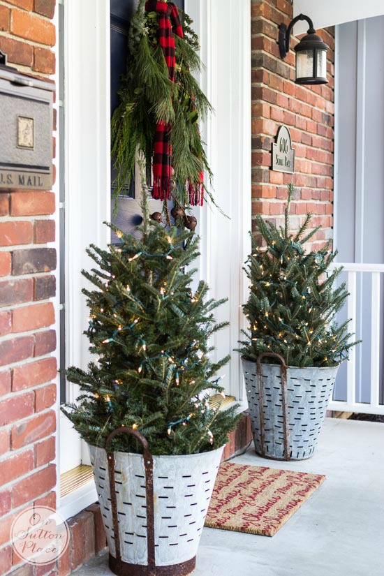 Frugal Christmas porch decor with olive buckets.