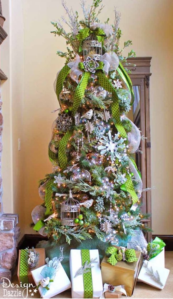 Jeweled forest Christmas tree with vertically wrap green ribbon.