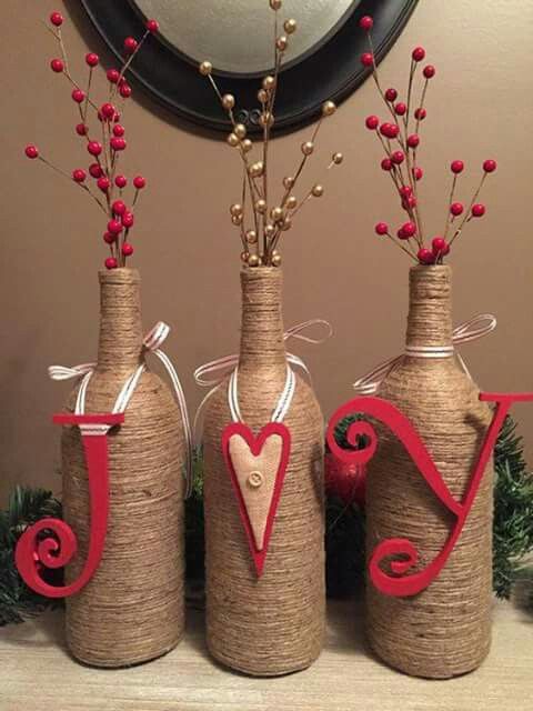 Jute wrapped bottles with joy sign.