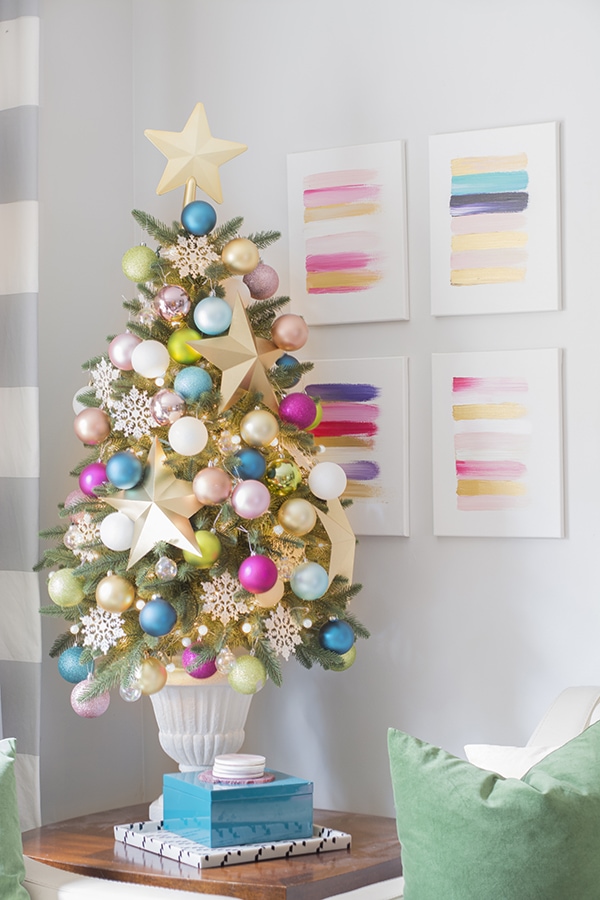 Mini Christmas tree decorated with pastel color balls.