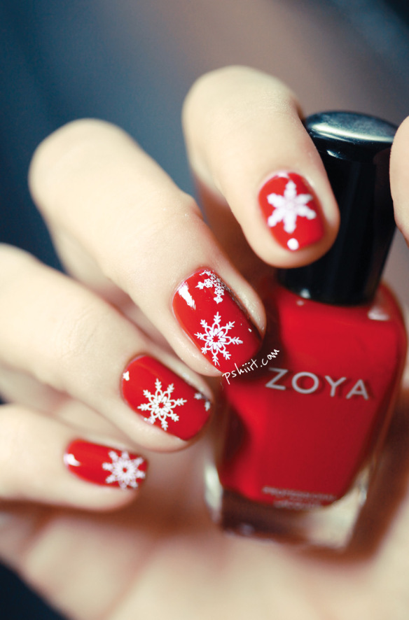 Red nails with snowflakes.