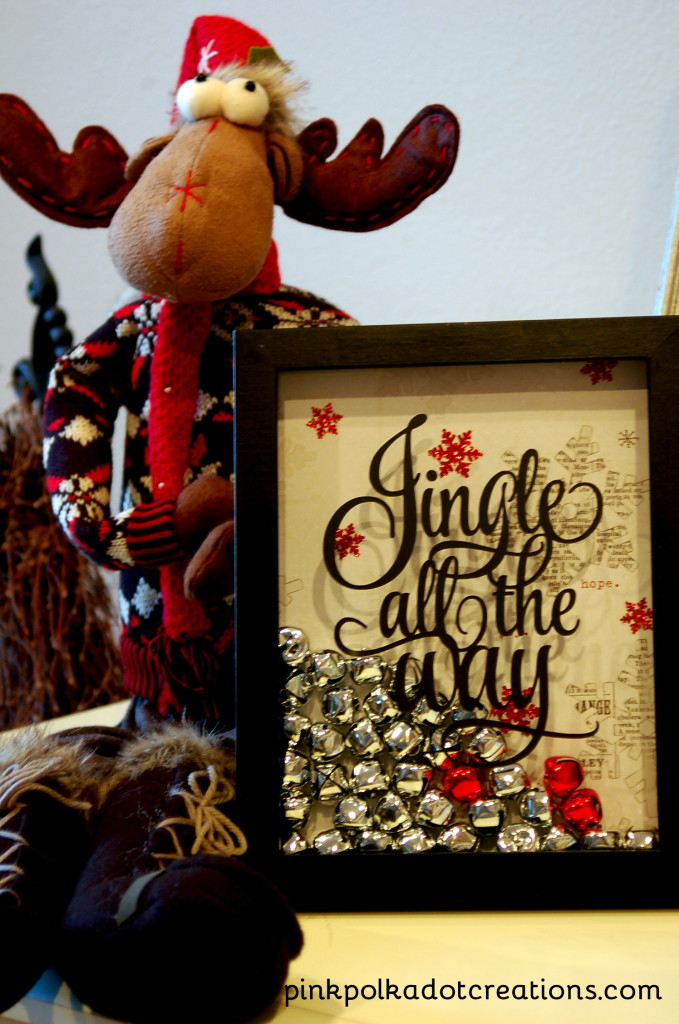 Red & silver jingle bells shadow box decoration.