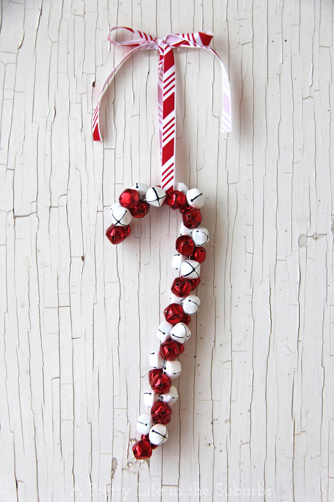Traditional red & white diy candy cane jingle bell ornament.