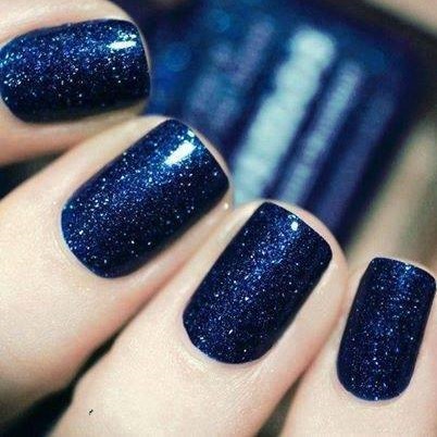 Vibrant glittery blue nails.