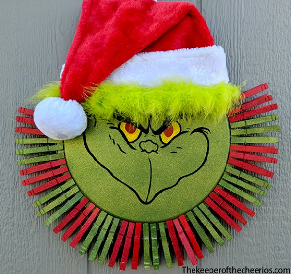 Whimsical grinch clothespin wreath.