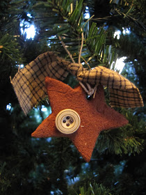 Adorable cinnamon ornament decorated with button and scarf.