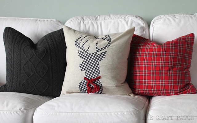 Beautiful pillow with reindeer appliqued in a black and white plaid.