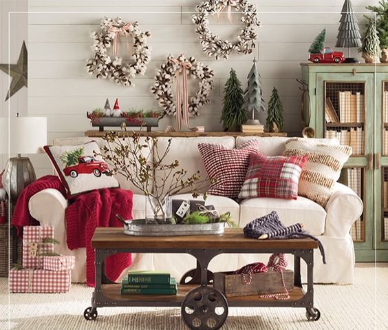 Beautiful wreaths and movable table in living room.