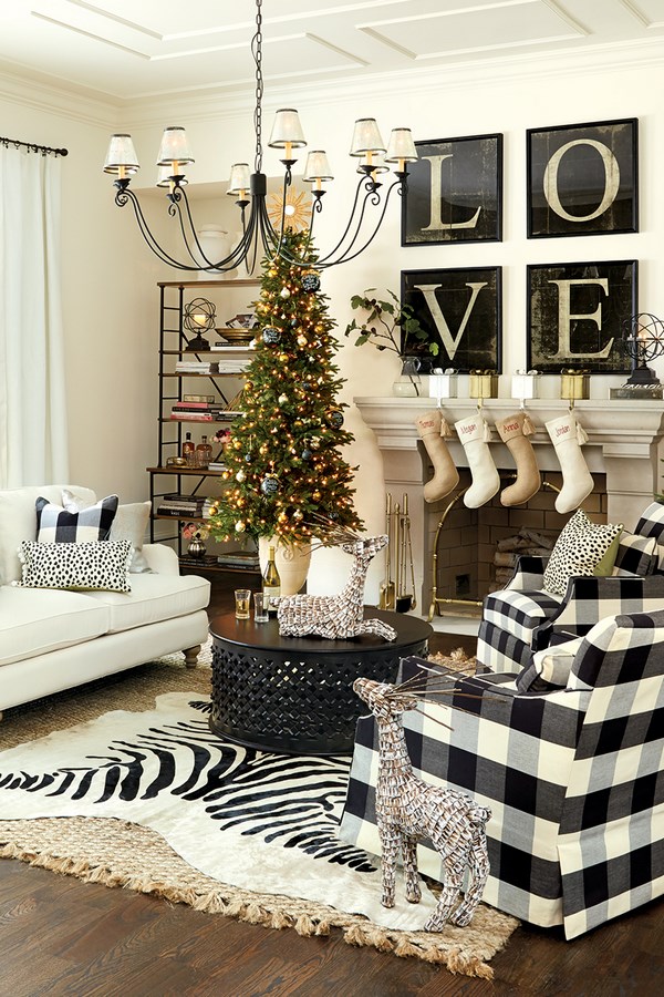 Black and white plaid furniture with classic Christmas tree, stocking & metal reindeer.