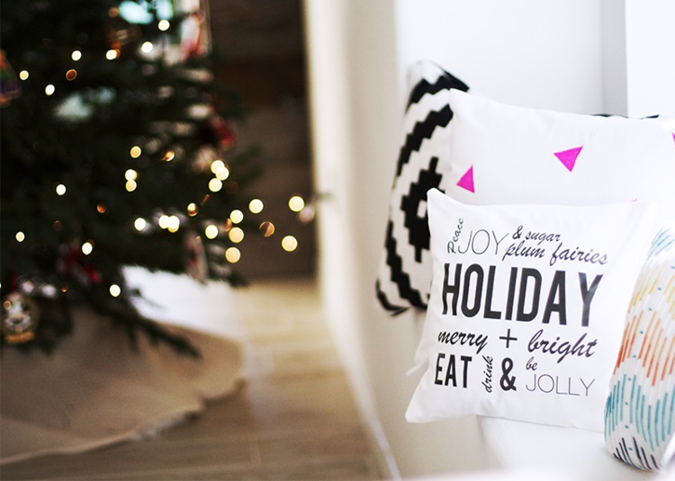 Black & white Christmas pillow with wishes.