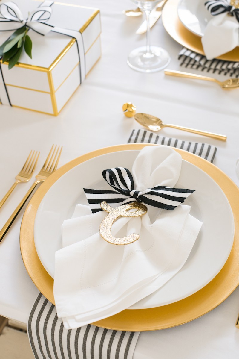 Chic golden theme table setting for Christmas.
