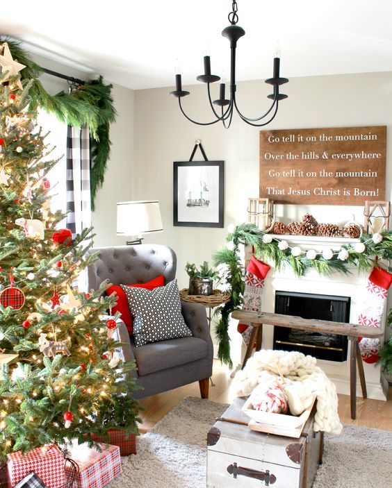 Cozy Christmas decor with oversized pinecones, evergreen garland and stockings.