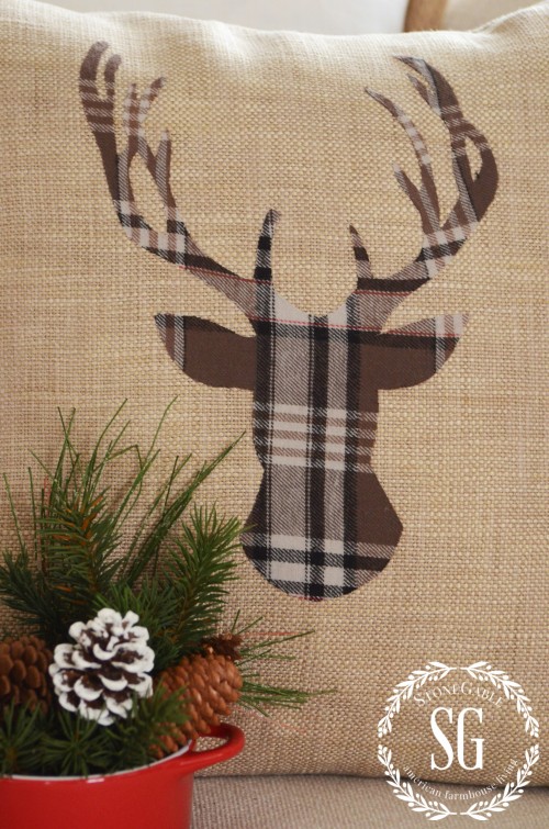 Dashing woodland Christmas deer pillow.