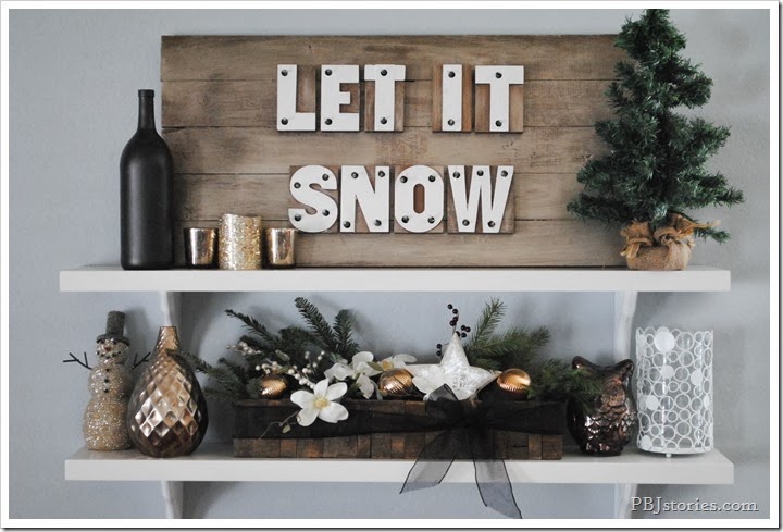 Feel cozy with Let It Snow sign board.