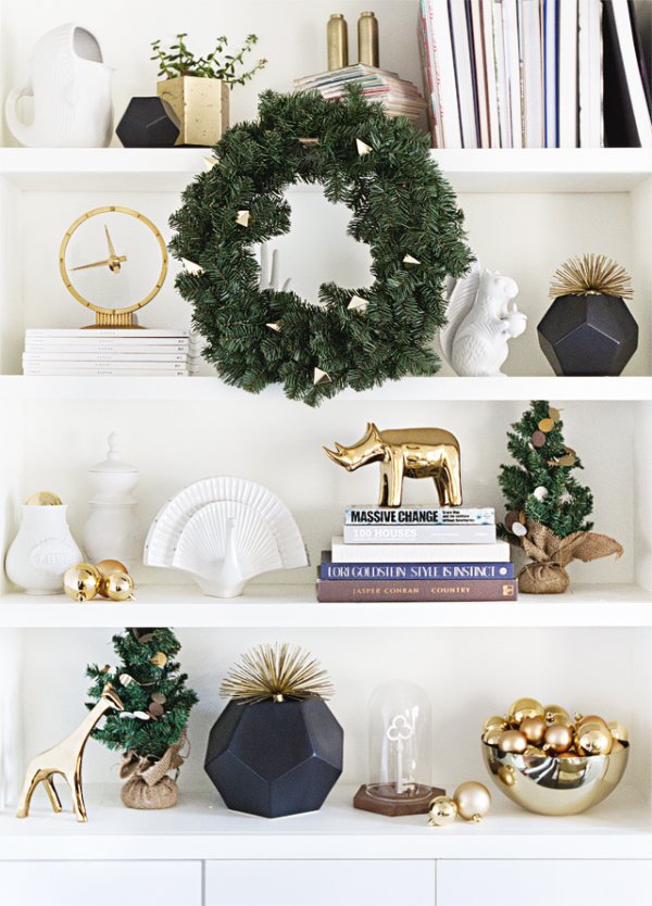 Golden accessories with natural wreath and mini Christmas tree.