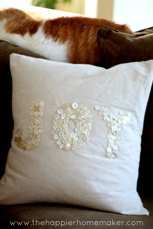 Joy button pillow for Christmas.