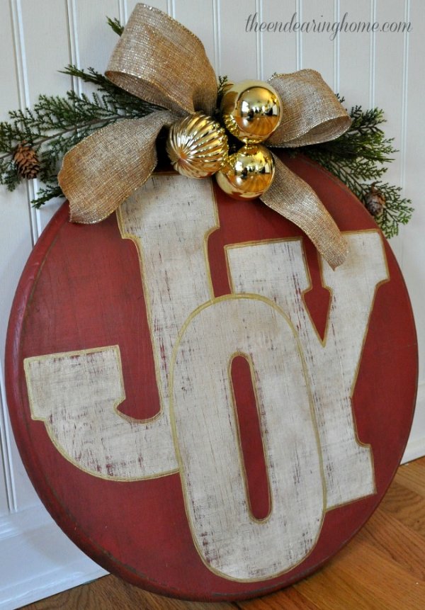 Oversized wood ornament of joy sign.