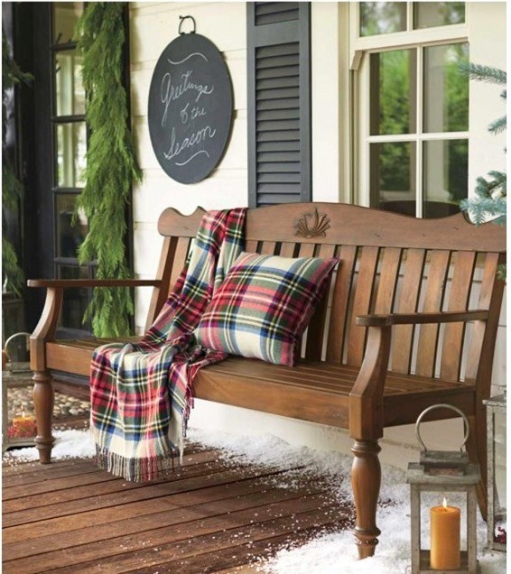 Plaid pillow and blanket used for foyer decor.