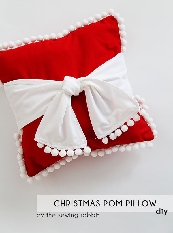 Red & white pom pom pillow for Christmas.