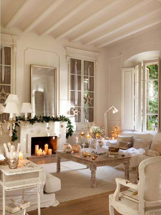 Sophisticated living room decor with fresh garland and hanging stars.